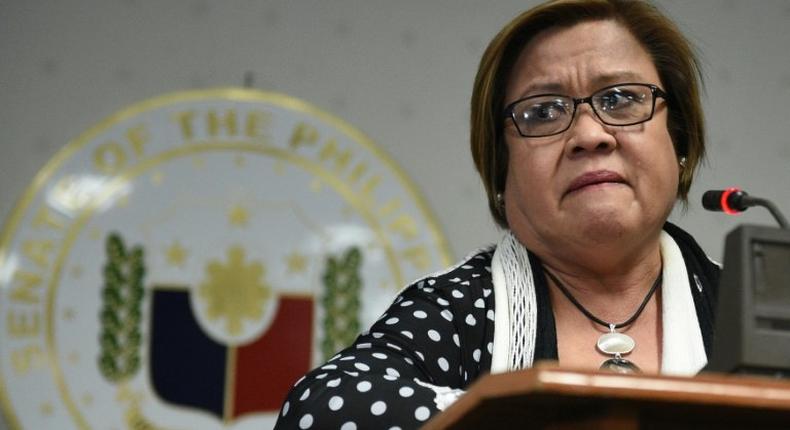 Philippine Senator Leila De Lima fights back tears as she speaks to reporters in Manila, on February 23, 2017