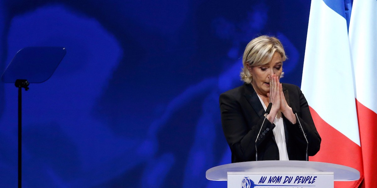 Marine Le Pen brutally attacks her French election rivals as protests erupt at Front National rally