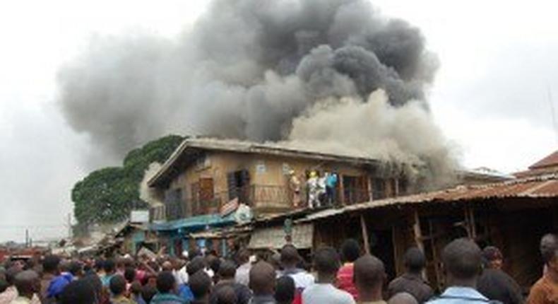 A scene of shops being razed by fire