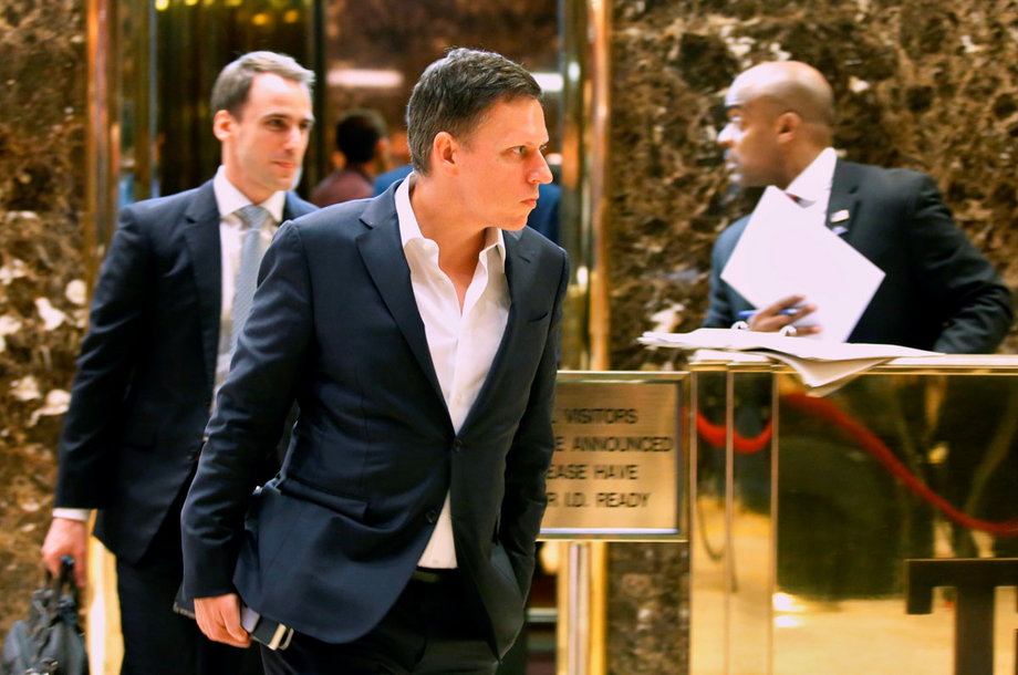 Peter Thiel walks out of Trump Tower.