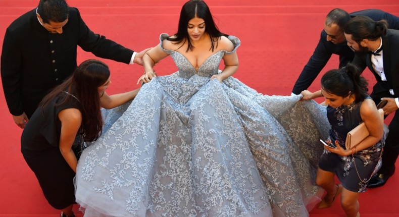 Bollywood actress Aishwarya Rai Bachchan needed a team of five to help her up the stairs at Cannes