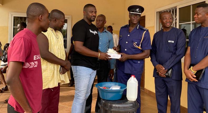 John Dumelo donates items to Ayawaso West police officer to fight coronavirus 