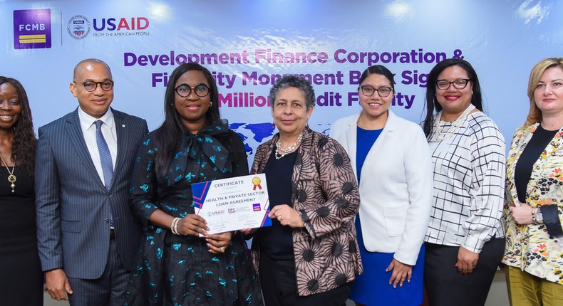 Head, International Funding and DFIs, First City Monument Bank (FCMB), Mrs. Olubunmi Smith; Group Head, Business Banking, Mr. George Ogbonnaya; Managing Director of the Bank, Mrs. Yemisi Edun; Mission Director of the United States Agency for International Development (USAID), Melissa Jones; Private Enterprise Officer of the Agency, Rose Quispe-Lopez; Deputy Political and Economic Section Chief Economic Officer, United States Consulate General, Lagos, Kenise Hill and Contracting Officer, USAID, Ani Strakosha,, during the signing of a partnership agreement to facilitate $10 million in new loans for underserved borrowers, MSMEs in the health sector and informal businesses from all sectors of the economy on Wednesday, May 8, 2024, in Lagos.