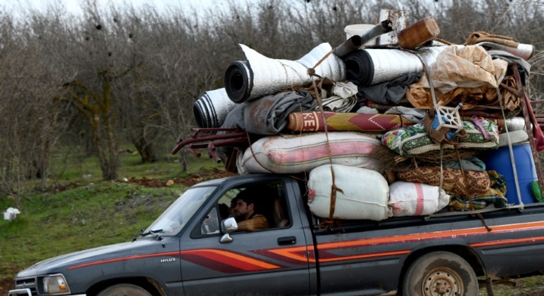 In a call with his Turkish counterpart, Trump voiced concern at violence in Idlib, Syria; a truck loaded with furniture passes an internally-displaced persons (IDP) camp  February 16, 2020, as people flee advancing Syrian government forces in Idlib and Aleppo provinces