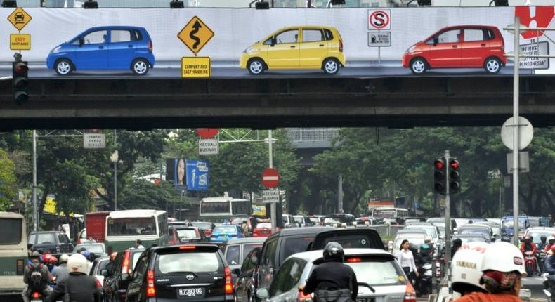 The X-rated clip was seen by motorists as they crawled along the major road in Jakarta