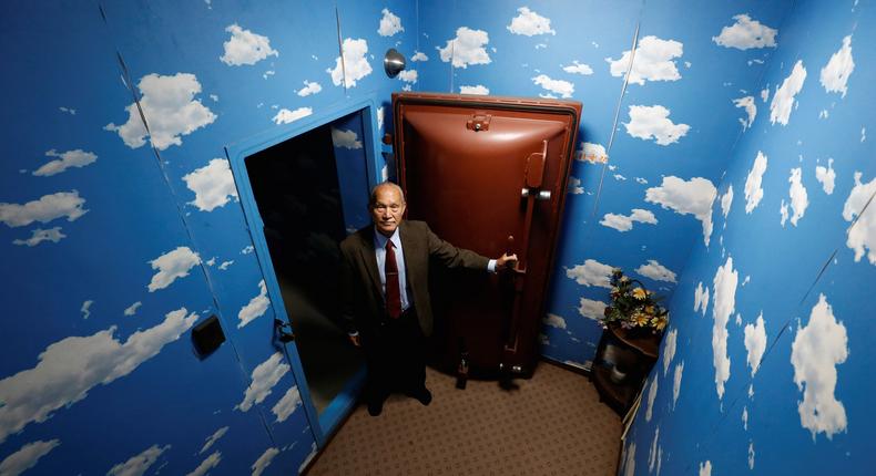 Seiichiro Nishimoto, CEO of Shelter Co., poses at a model room for the company's nuclear shelters in the basement of his house in Osaka, Japan.