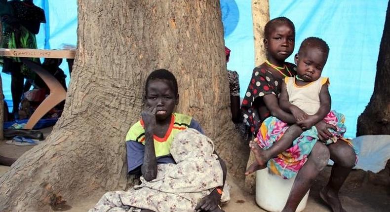 South Sudanese children sit outside their makeshift shelter in SPLA-IO rebel control area in the Southern part of Unity State Paynjiar County, March 20, 2015. Picture taken March 20, 2015. REUTERS/Denis Dumo