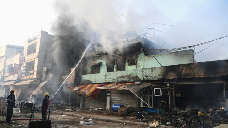 Several buildings were torched in clashes between supporters and opponents of a controversial new Indian citizenship law