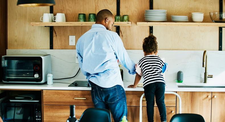 dad and daughter washing dishes