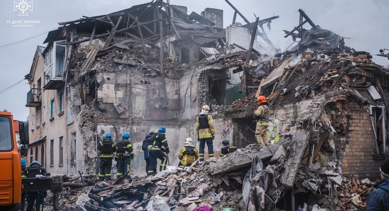 Rescuers work at a site of a residential building that was heavily damaged by a Russian missile strike in the town of Novohrodivka, Donetsk region, Ukraine, on November 30, 2023.Press service of the State Emergency Service of Ukraine in Donetsk region/Handout via REUTERS