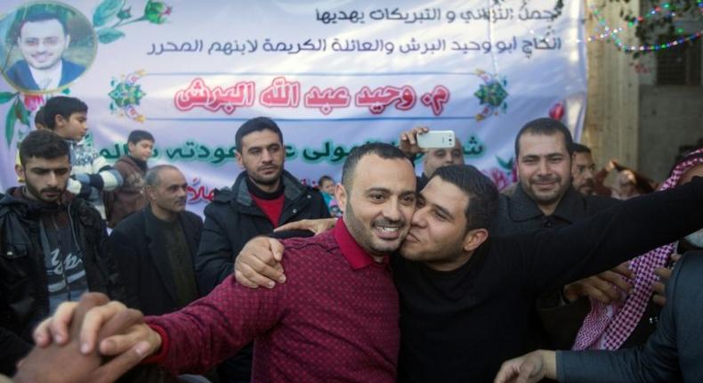 UN worker Waheed Borsh (centre) celebrates with his Palestinian relatives after he was released from an Israeli prison on January 12, 2017