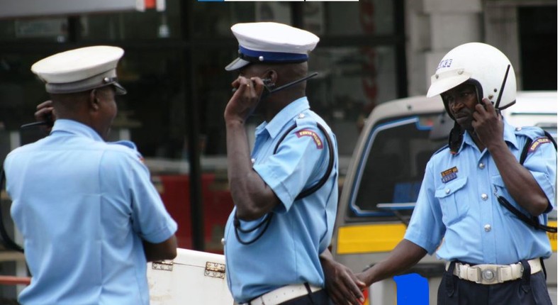 File image of Traffic Police Officers on duty The DCI has released a list of 9 vehicles wanted in connection with an ongoing investigation