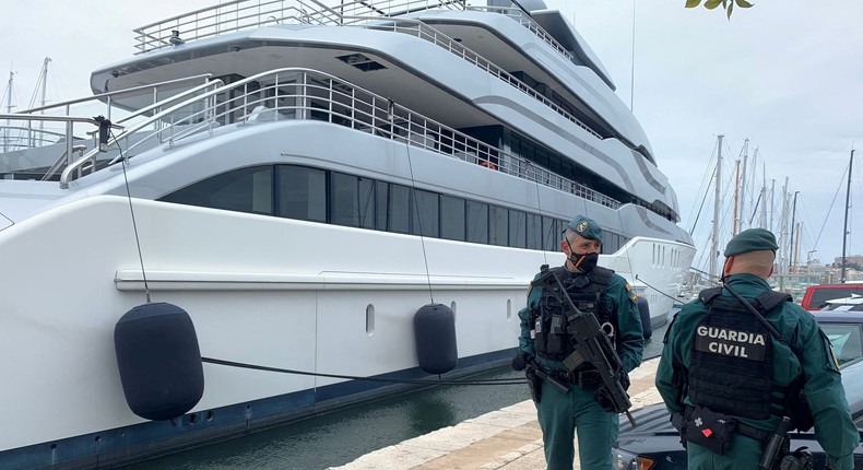 Spanish Civil Guards stand by the Tango superyacht, belonging to Russian oligarch Viktor Vekselberg, which was seized on behalf of U.S. authorities on the Spanish island of Mallorca.