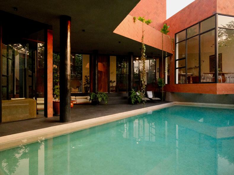 Part of the dining area cantilevers over a corner of the pool.Amanda Goh/Business Insider