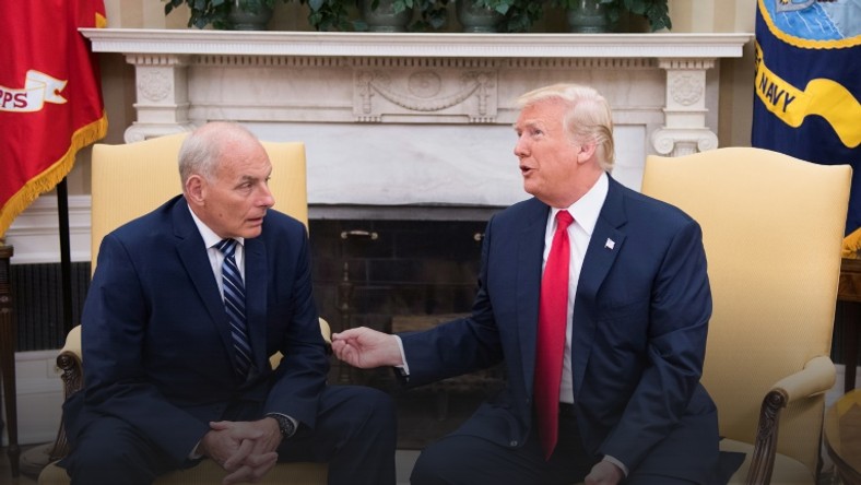 Outgoing White House Chief of Staff John Kelly, pictured with President Donald Trump in July 2017, told the Los Angeles Times that many migrants have been misled by traffickers