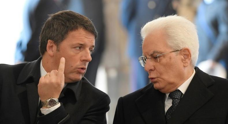 Italy's President Sergio Mattarella (R) speaks with Italys' former Prime Minister Matteo Renzi before a ceremony for the closing of the Jubilee of Mercy, on November 20, 2016