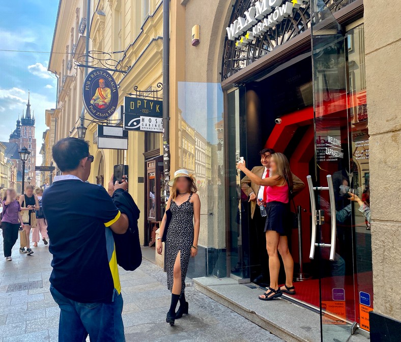 Tourists gather in front of the museum to take a souvenir photo with Lewandowski, Mr. Bean, or maybe... the famous Polonia Wax Museum.