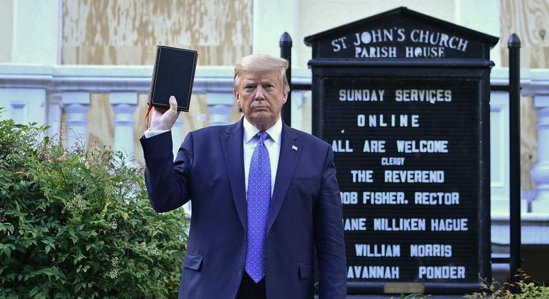 President Donald Trump holds up a Bible outside of St John's Episcopal church across Lafayette Park in Washington, DC on June 1, 2020.BRENDAN SMIALOWSKI/AFP via Getty Images