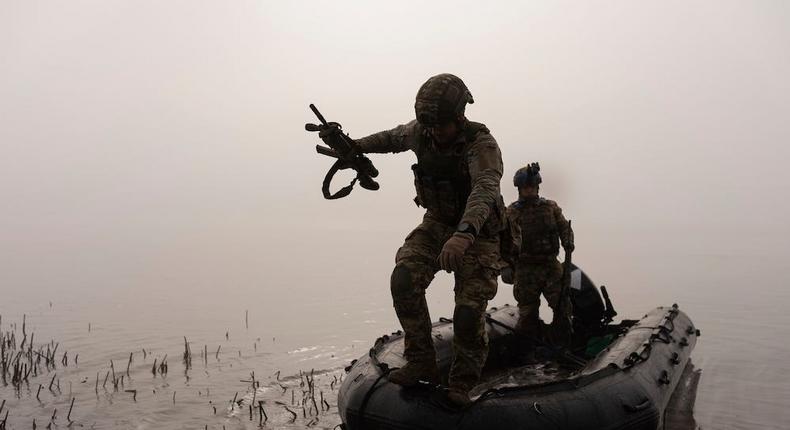 A Ukrainian serviceman jumps out of the boat onto the shore of the Dnipro near Kherson, Ukraine, October 15, 2023.Alex Babenko/AP Photo