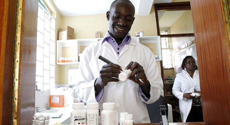 Michael Otieno, a pharmacist, dispenses anti-retroviral (ARV) drugs at the Mater Hospital in Kenya's capital Nairobi