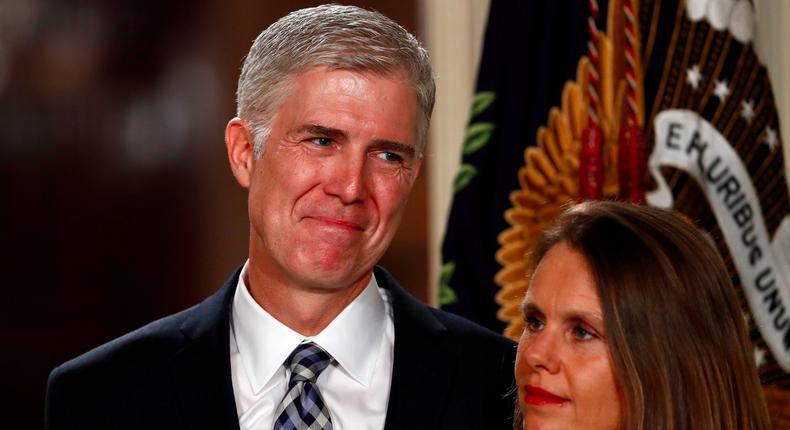 Judge Neil Gorsuch stands with his wife Louise.