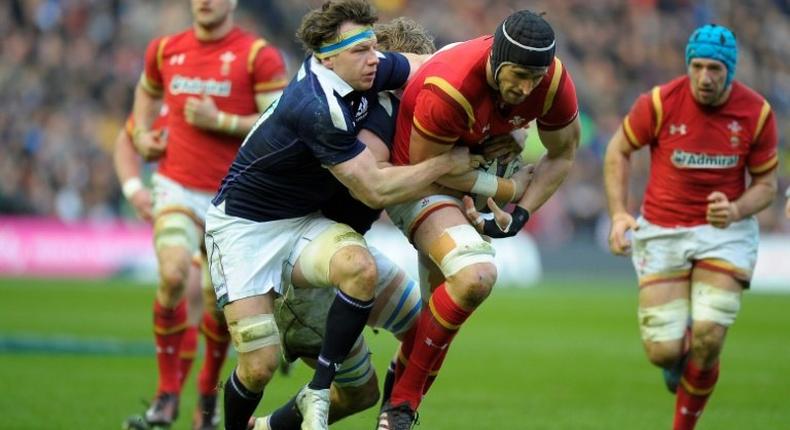 Scotland's Hamish Watson (left) tackles Wales' lock Luke Charteris during the Six Nations rugby union match at Murrayfield in Edinburgh on Febuary 25, 2017