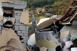 Collapsed houses are seen after an earthquake hits the island of Ischia, off the coast of Naples