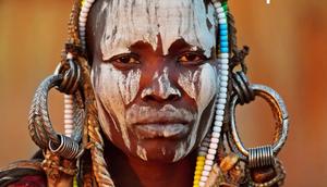 Why girls of the Mursi tribe must remove their teeth and stretch their lips before they marry