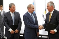 Russia's President Putin, Rosneft CEO Sechin and Exxon Mobil CEO Tillerson take part in signing cere