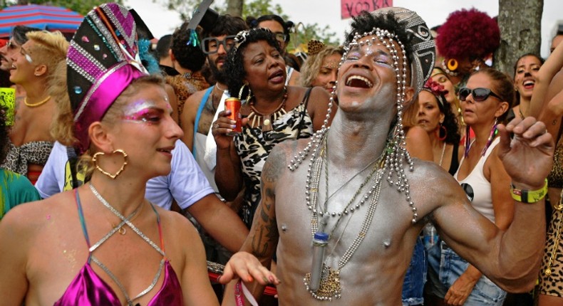 Revellers let loose in Rio de Janeiro ahead of the city's fabled carnival parades when 13 top samba schools compete for the title of carnival champions