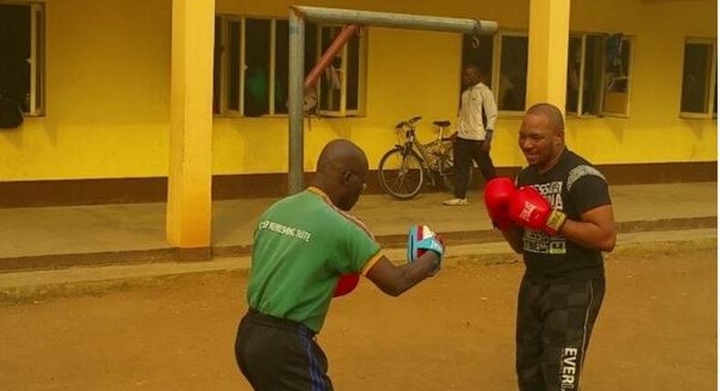 Tee A boxing with his trainer 