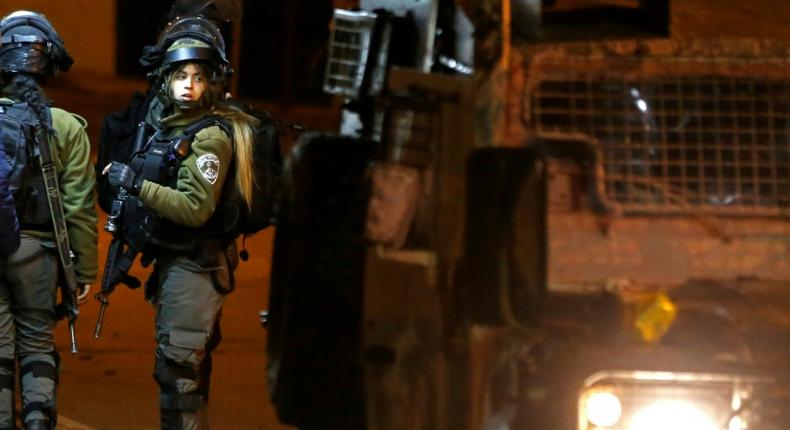 Israeli soldiers clash with Palestinian protesters during an incursion into the West Bank city of Ramallah on January 7, 2019