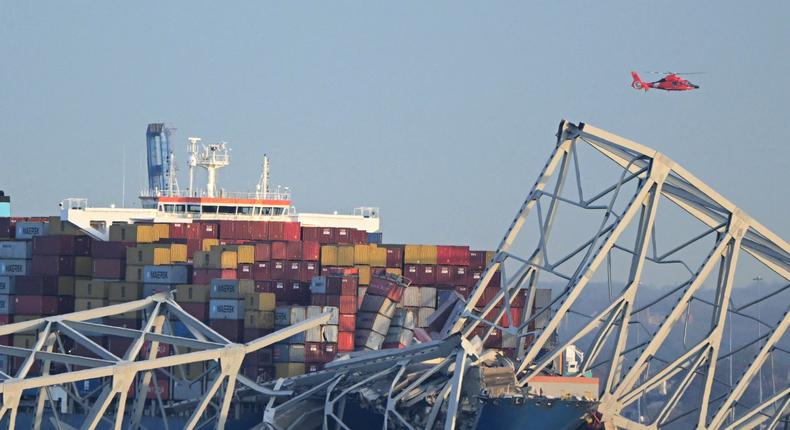 The steel frame of the Francis Scott Key Bridge sits on top of the container ship Dali after the bridge collapsed, Baltimore, Maryland, on March 26, 2024.Mandel Ngan/AFP/Getty Images