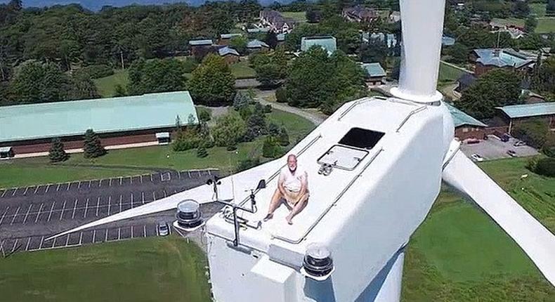 Drone catches man on top of a 200ft wind turbine