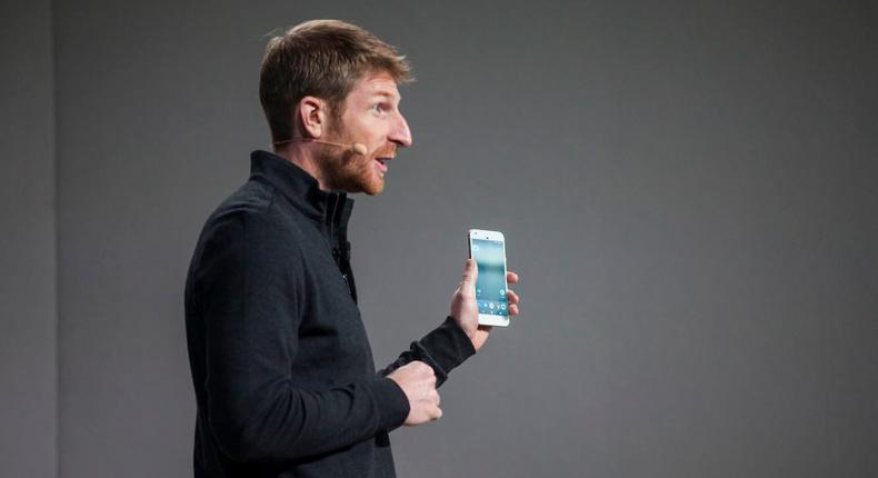 Brian Rakowski, VP of Product Management at Google, holds a Pixel during an event to introduce the phone.