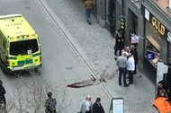 Ambulance in a street near the site were a truck was driving into a crowd in central Stockholm