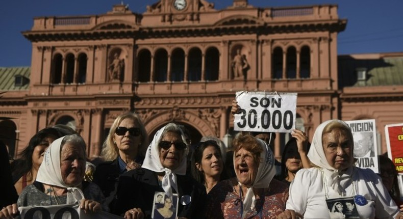 Members of the Argentine human rights group Madres de Plaza de Mayo rally in front of the presidential palace in Buenos Aires to mark the 40th anniversary of their first protest demanding answers about kin who went missing during military rule