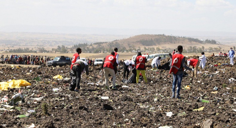 Red Cross officials recover bodies form the scene of the Ethiopian Airlines ET 302 plane crash (Twitter)