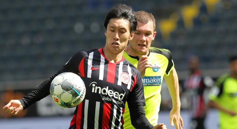 Eintracht Frankfurt's Japan forward Daichi Kamada (L) has extended his contract with the Bundesliga side until 2023