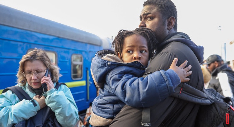 People wait to board an evacuation train from Kyiv to Lviv at Kyiv central train station, Ukraine, February 25, 2022.