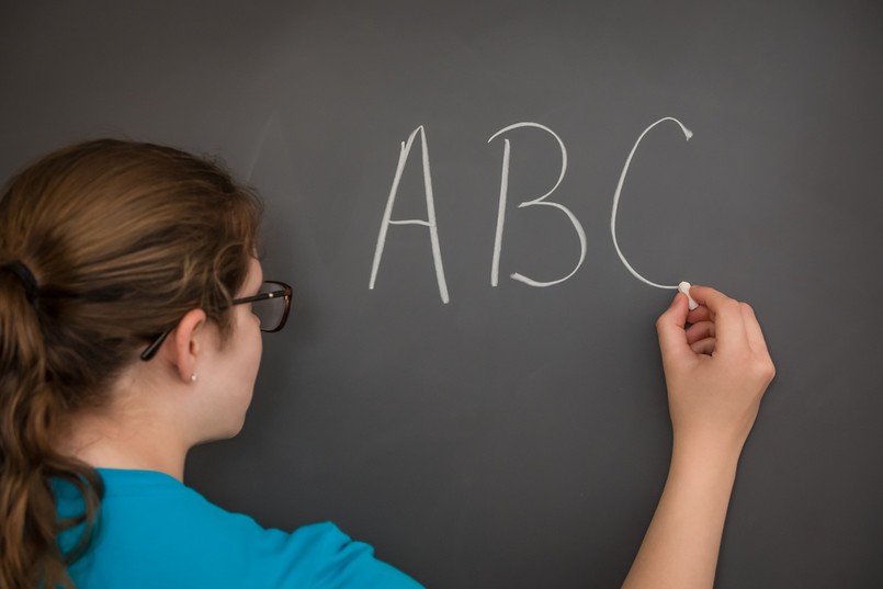 A,Teacher,Writing,The,Abc's,On,The,Chalkboard