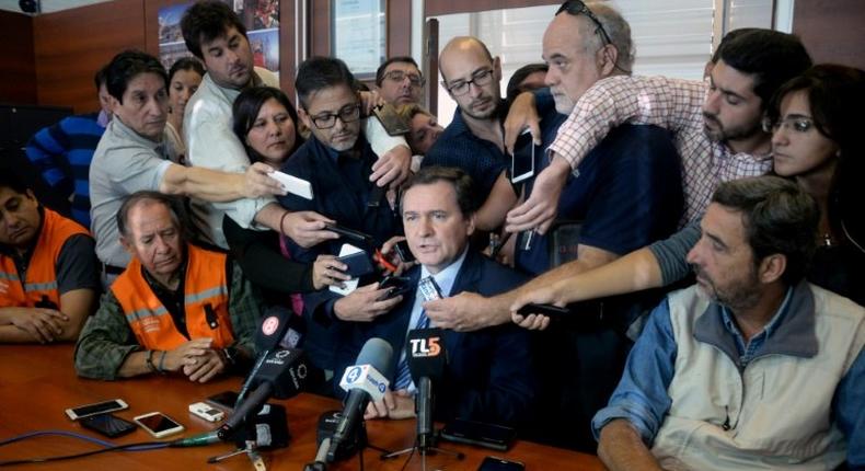 San Juan's province Mining Minister Alberto Hensel (C) speaking during a press conference in San Juan, west of Argentina on March 30, 2017