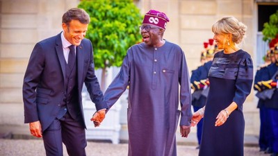 President Bola Tinubu shares laugh with French President [Presidency]