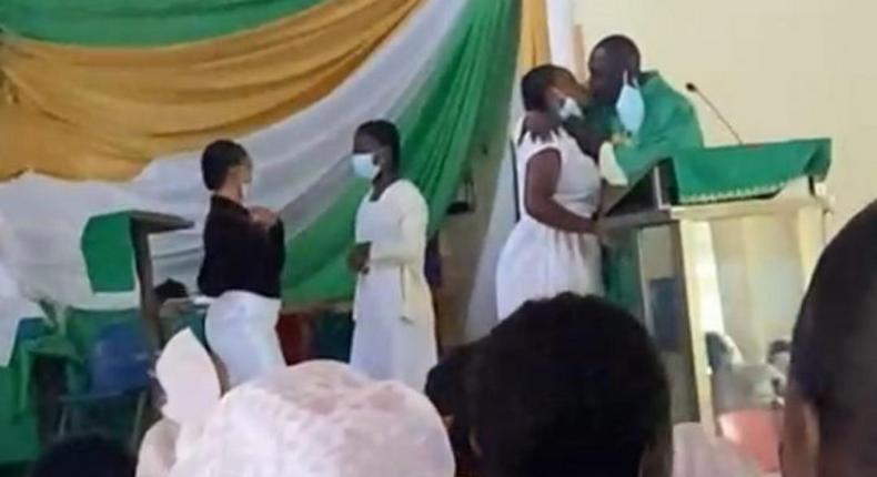 Anglican Priest kissing students