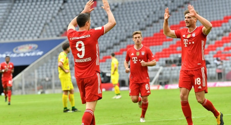 Robert Lewandowski (3rd L) celebrates scoring for Bayern Munich against Cologne on Saturday