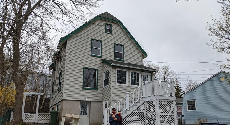 Erin Ventura and her husband in front of their new home.Erin Ventura