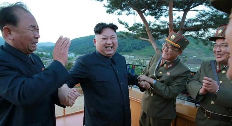 North Korean leader Kim Jong-Un, shown reacting during an earlier missile launch, has overseen a test of a new anti-aircraft guided weapon system, according to state media
