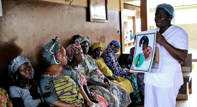 Blandine Mekpo, a midwife at a maternity ward, provides information about AIDS to pregnant women in Bohicon, southern Benin