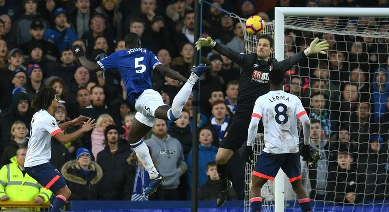 Kurt Zouma (2L) heads in the opening goal of Everton's 2-0 win over Bournemouth in the Premier League at Goodison Park on Sunday