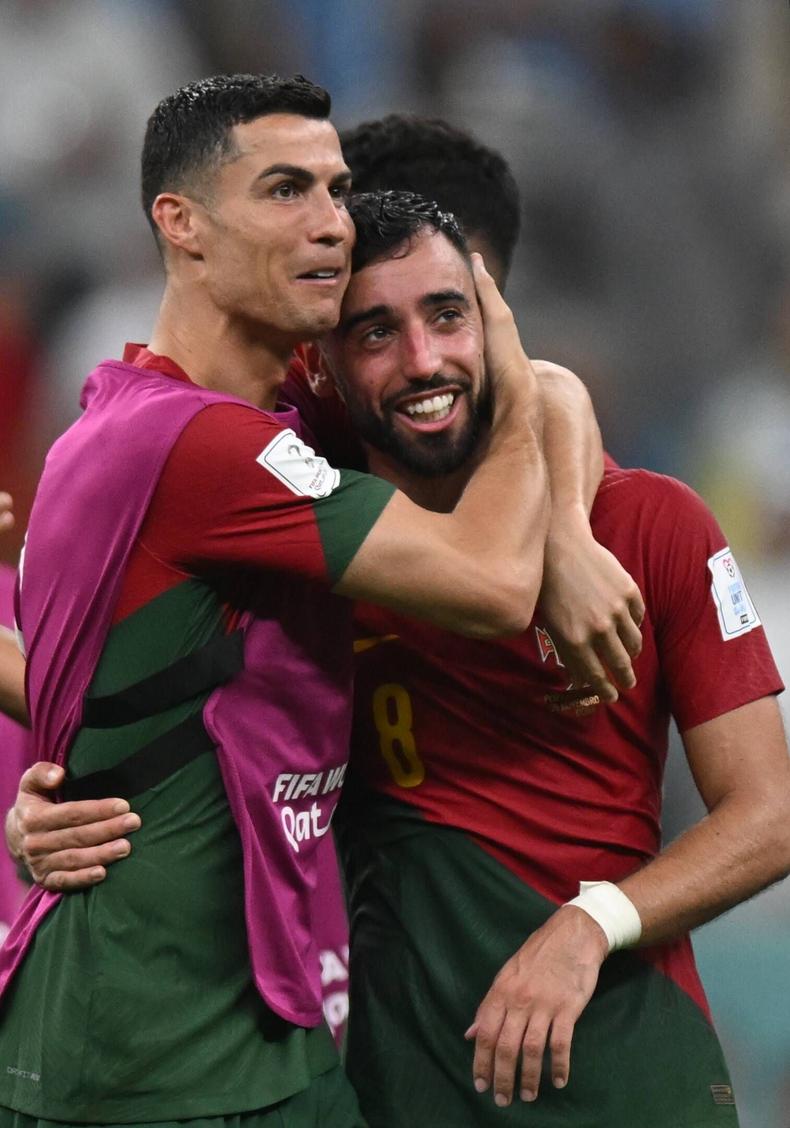 Portugal's Cristiano Ronaldo and Bruno Fernandes celebrate the victory in the Qatar 2022 World Cup Group H soccer match between Portugal and Uruguay on November 28, 2022.